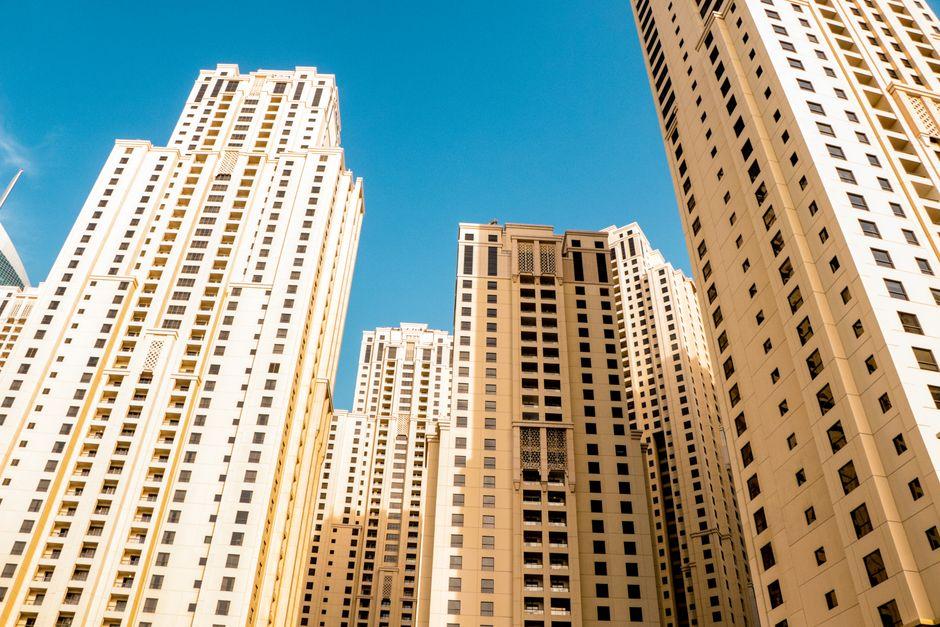 Tall Residential Buildings Against Blue Sky