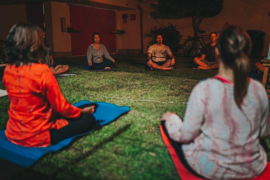 Meditation Group of People Sitting on the Ground
