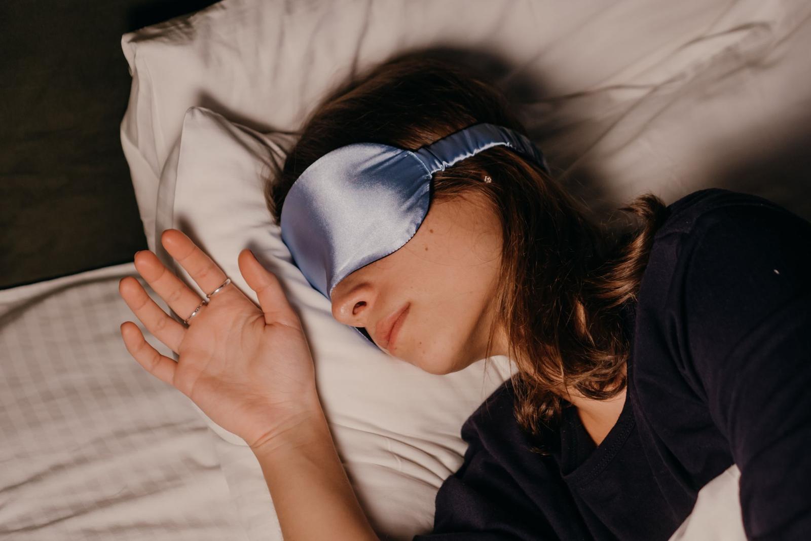 A Woman Wearing a Sleep Mask