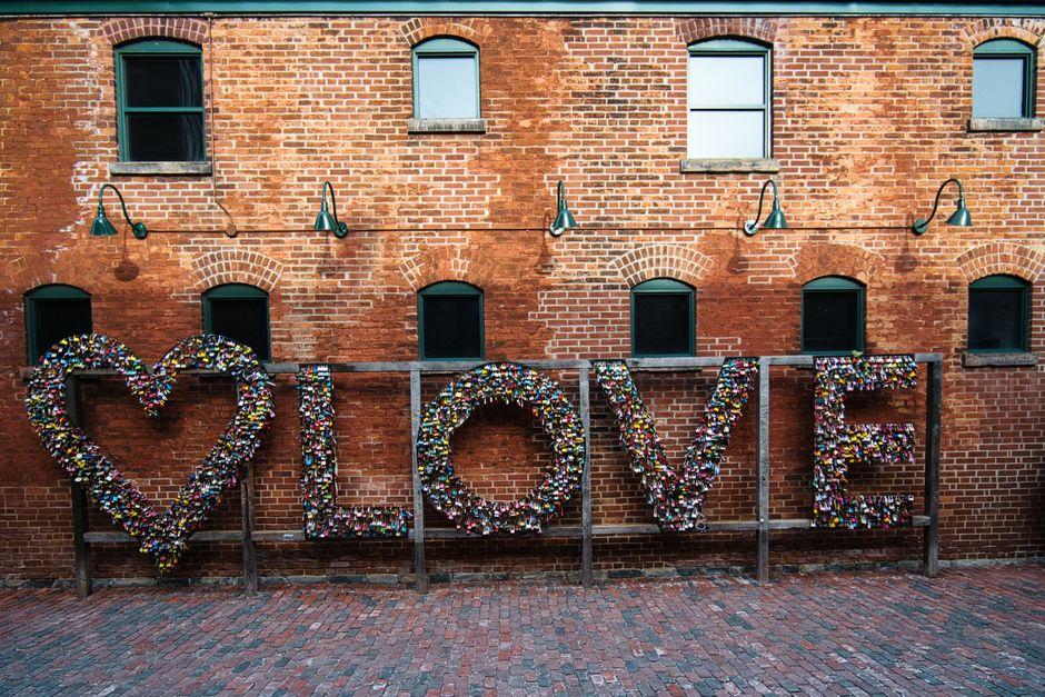Love Word Decoration on Red Brick Concrete Wall